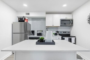 Fridge, microwave, oven, stovetop - 5 Min to Love Field | Gated+Guard | 2BR | Parking (Dallas)