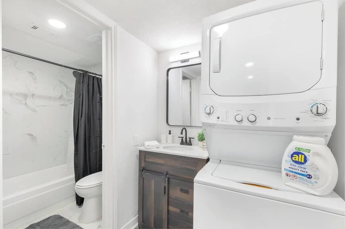 Shower, hair dryer, towels, shampoo