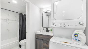 Shower, hair dryer, towels, shampoo