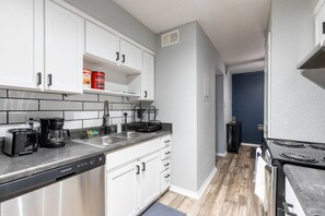 Fridge, microwave, oven, stovetop - Walk to AT&T Stadium - Modern 1BR Game Day Stay (Arlington)