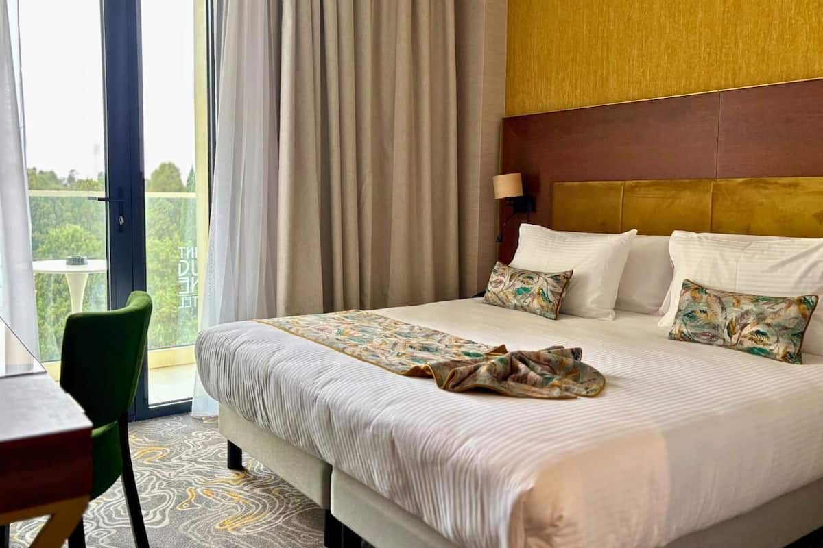 Suite de lujo, vista al mar | Caja de seguridad en la habitación y escritorio