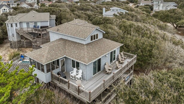 A two-story beachfront house with a deck, outdoor seating, and a small pool. - 3946 - Summers by the Sea - Duck OBX Retreat w/ Pool & Hot Tub Near Beach (Duck)