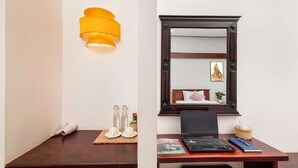 A room with a desk, a laptop, a mirror, and a wall-mounted lamp. - 6 Rooms Exclusive Villa in Siem Reap — Wellness & Culture Immersion (Siem Reap)