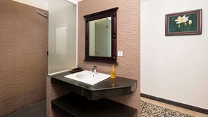 A bathroom with a white sink, a mirror, and a framed picture on the wall. - 6 Rooms Exclusive Villa in Siem Reap — Wellness & Culture Immersion (Siem Reap)