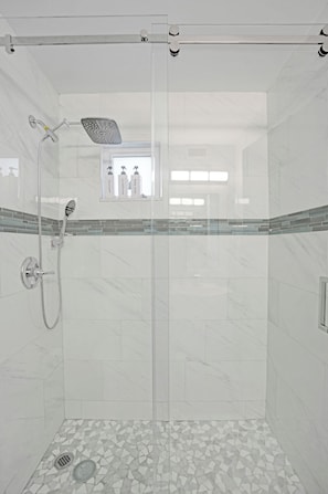 Shower, hair dryer, towels, soap