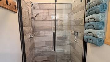 Shower, hair dryer, towels, soap