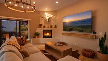 Smart TV, fireplace, books, stereo