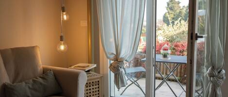 Standard Apartment | Living area | 50-inch Smart TV with cable channels