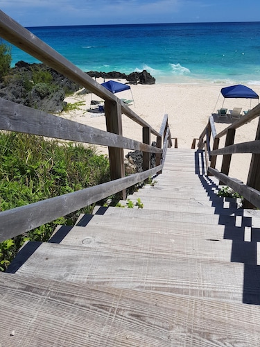 Private pool and private beach in this wonderful Warwick beachfront apartment