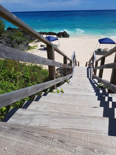 Private pool and private beach in this wonderful Warwick beachfront apartment