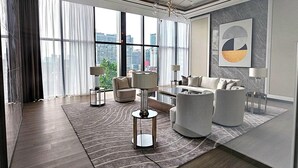 A modern, well-lit function room with large windows, a chandelier, and a city view. - 2BR Luxury Living KLCC 600mbps (Kuala Lumpur)