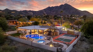 A resort with a swimming pool, outdoor seating, and a tennis court. - Mini Resort w/ Mountain Backdrop | Heated Pool, Hot Tub, Sauna, Cold Plunge (Phoenix)