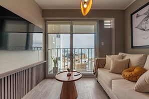 TV - geko| Jade _2BR, modern escape steps from Malecon (Lima)