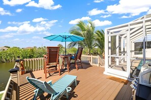 Outdoor dining - Canal-Side Oasis w/ Epic Game Room | 4BR Pool Home (Cape Coral)