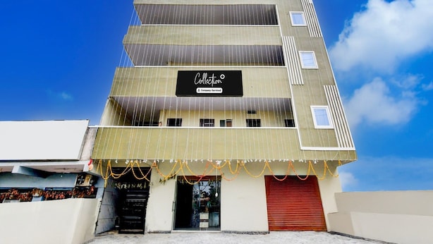 A multi-story building with a sign reading 'Collection Company-Serviced.' - Super Collection O Srisailam Highway (Hyderabad)