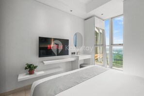 Apartment, 1 Bedroom, Ocean View | Desk, laptop workspace, iron/ironing board, free WiFi - Mahina by Kozystay - PIK (Jakarta)
