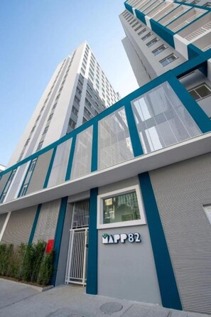 A modern building with a prominent 'MAPP 82' sign, featuring a sleek design with blue accents and large windows. - 2-bedroom apartment in awesome São Paulo with fitness room, AC (São Paulo)