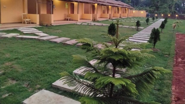 A row of single-story buildings with a thatched roof, arranged in a linear fashion. - Angel Eco Resort & Restaurant Cox'sBazar (Cox's Bazar)