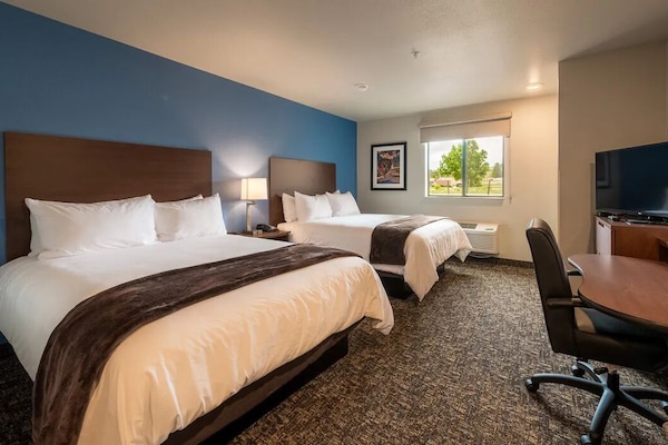 Settle into crisp bedding and unwind in your spacious room.