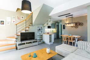 Deluxe Villa, Sea View | Living area | 43-inch flat-screen TV with satellite channels, fireplace