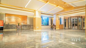 A spacious lobby with a marble floor, a reception desk, and a large digital display. - Fuzhou Royal Hot Spring Hotel & Resort (Fuzhou)