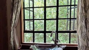 A bathroom with a window, a sink, and a towel. - The Cottage is Situated on a Farm in Laikipia 32km From Nanyuki - 2330 (Ethi)