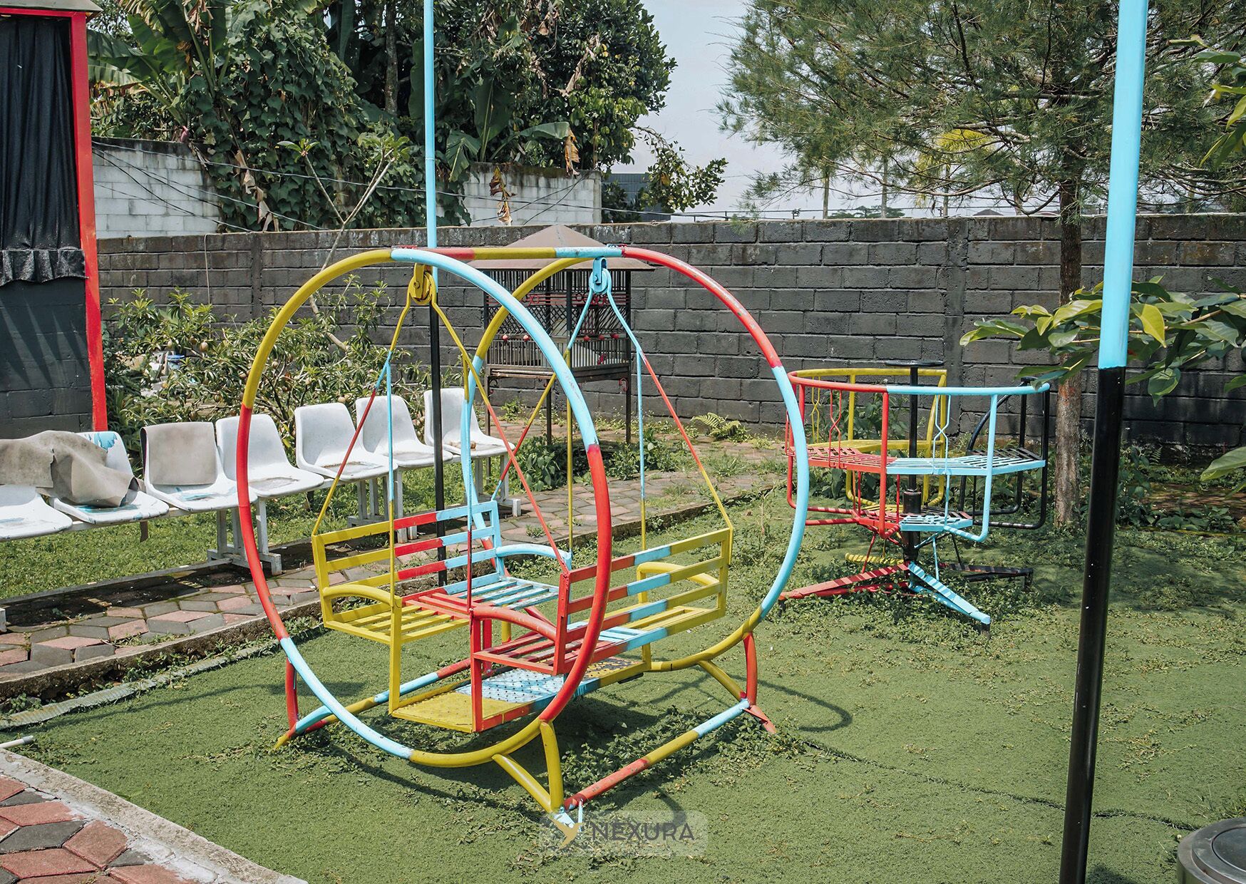 A playground with swings, slides, and a climbing structure.
