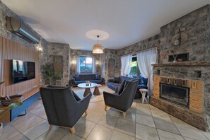 Villa exclusiva, vista al jardín | Área de sala de estar