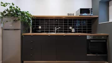 Unit 2 - Studio Apartment | Private kitchen | Mini-fridge, microwave, oven, stovetop