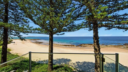 Beachfront Breeze - Family Getaway by HolidayCo.