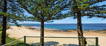 Beachfront Breeze - Family Getaway by HolidayCo.