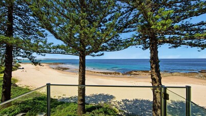 Beachfront Breeze - Family Getaway by HolidayCo.