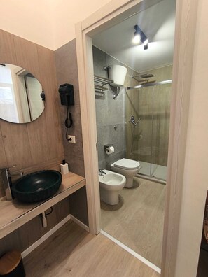 Family Quadruple Room, Non Smoking, Balcony | Bathroom | Shower, hair dryer, towels, soap