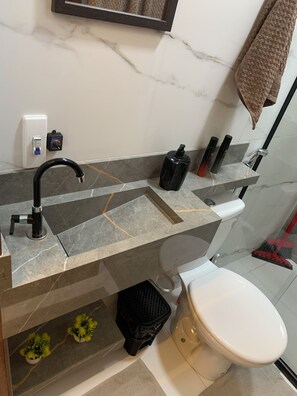 Shower, towels, soap, toilet paper