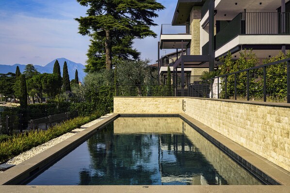 Seasonal outdoor pool, pool loungers