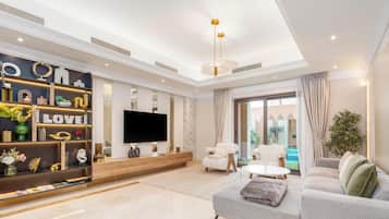 Luxury Townhome, 3 Bedrooms, Private Pool | Living area | 55-inch Smart TV with cable channels