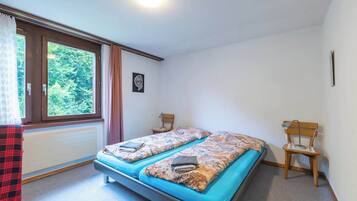 1 bedroom, desk, iron/ironing board, travel crib