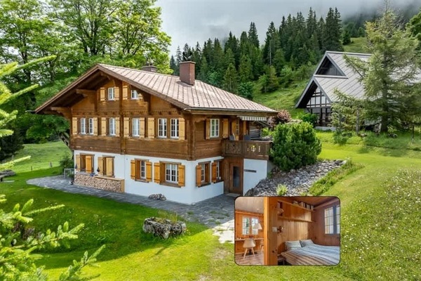 Swiss chalet style apartment surrounded by lush greenery, offering a peaceful alpine retreat in beautiful Axalp.