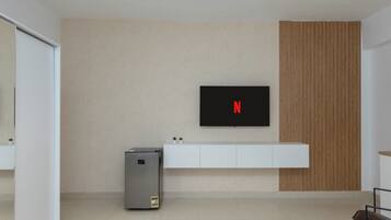 65-inch LCD TV with satellite channels, Netflix, streaming services