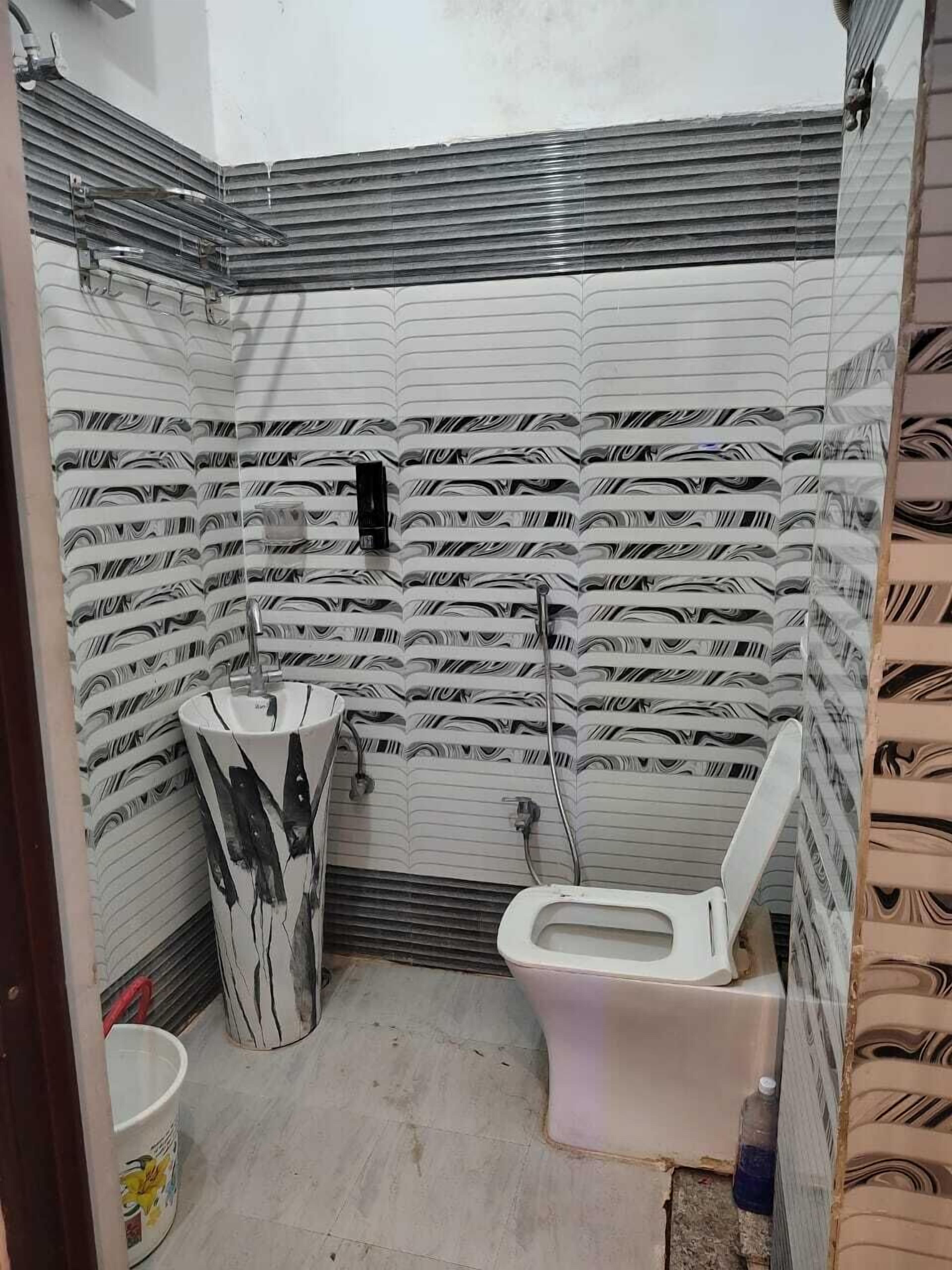 Dusj, håndklær, såpe og sjampo