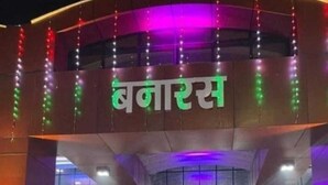 A building with a sign reading "Bank of India" in Hindi, featuring a modern architectural design with a glass facade and a staircase leading to the entrance. - Kashiyana Stay (Varanasi)
