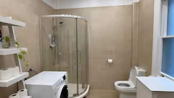 Shower, hair dryer, towels, soap