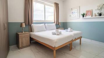 2 bedrooms, desk, iron/ironing board, travel cot
