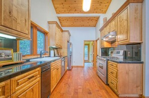 Kitchen - Escape to Sugar Pine Sunset! A spacious mountain retreat with stunning sunset views, luxe finishes, a private spa, and endless entertainment across three beautifully designed levels. (Shaver Lake)