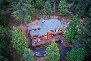 Aerial view looking down at the cabin - Escape to Sugar Pine Sunset! A spacious mountain retreat with stunning sunset views, luxe finishes, a private spa, and endless entertainment across three beautifully designed levels. (Shaver Lake)