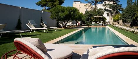 Seasonal outdoor pool, pool umbrellas, pool loungers