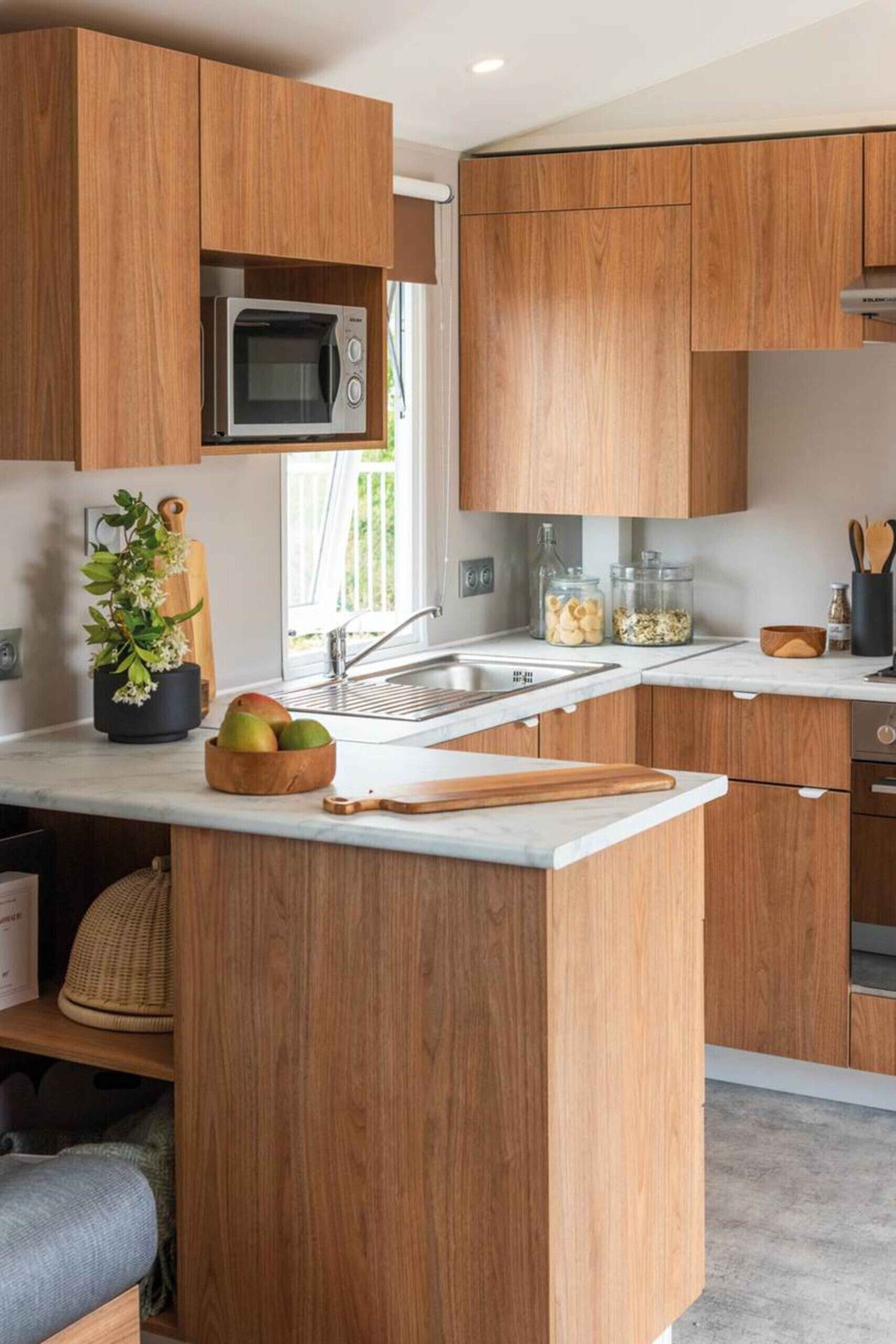 Fridge, microwave, coffee/tea maker, cookware/dishes/utensils