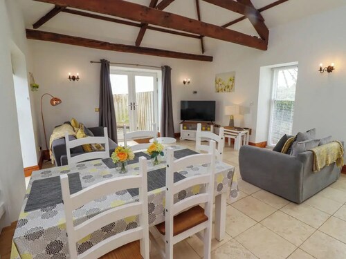 Heritage Grade-II listed barn conversion. Pet-friendly. Exclusive golf discount.