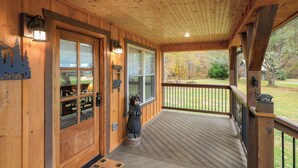 A wooden cabin entrance with a bear statue, a welcome sign, and a deck leading to a yard. - BEARLY LIVIN!  NEW CABIN ON 2 ACRES OF PRIVATE SMOKIES TROUT STREAM!  WOW !! (Cosby)