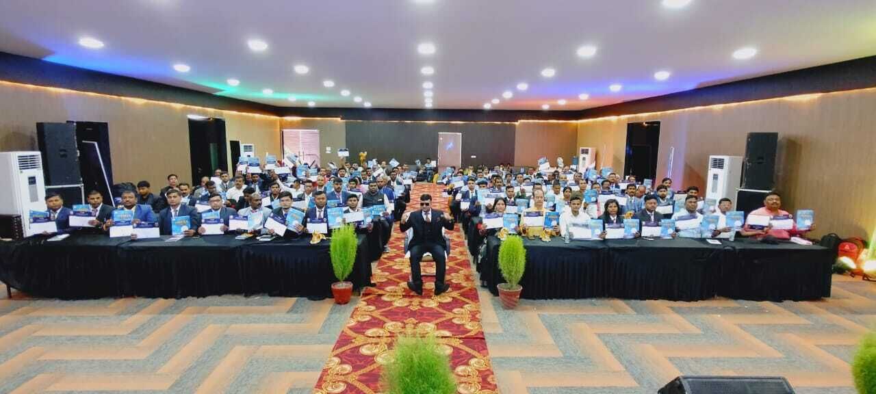 A conference room with a long table, chairs, and a podium.